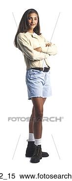Stock Image - a young female 
teen in a tan 
sweater and shorts 
folds her arms 
and. fotosearch 
- search stock 
photos, pictures, 
images, and photo 
clipart