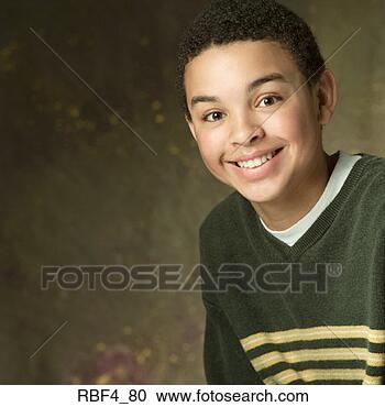 Stock Photography - portrait of an 
african american 
boy in a green 
sweater with yellow. 
fotosearch - search 
stock photos, 
pictures, images, 
and photo clipart