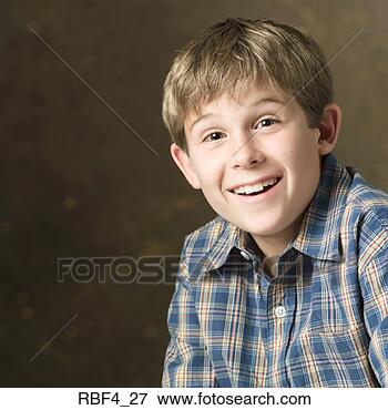 Picture - portrait of a 
young caucasian 
boy in a plaid 
shirt as he smiles 
big. fotosearch 
- search stock 
photos, pictures, 
images, and photo 
clipart