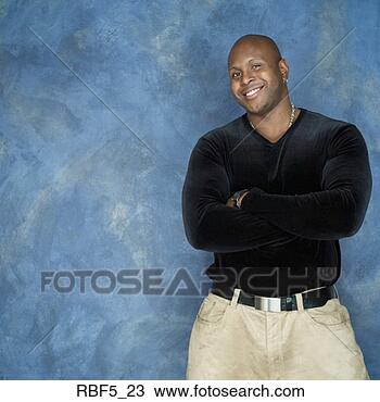Stock Photo - portrait of an 
african american 
man in a black 
shirt and tan 
pants as. fotosearch 
- search stock 
photos, pictures, 
images, and photo 
clipart