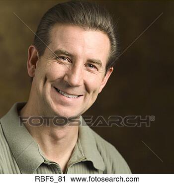 Stock Photography - a portrait of 
a caucasian man 
in a light green 
shirt smiles warmly 
at. fotosearch 
- search stock 
photos, pictures, 
images, and photo 
clipart