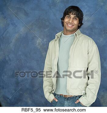 Stock Image - a portrait of 
a ethnic man in 
a light colored 
jacket and a blue. 
fotosearch - search 
stock photos, 
pictures, images, 
and photo clipart