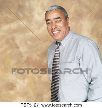 Picture - portrait of an 
older african 
american man in 
a grey shirt and 
tie as. fotosearch 
- search stock 
photos, pictures, 
images, and photo 
clipart