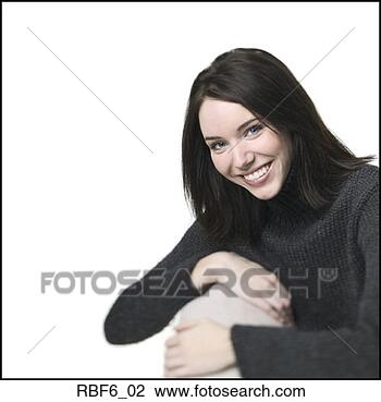 Stock Photo - studio portrait 
of a young adult 
woman in a black 
sweater as she 
sits. fotosearch 
- search stock 
photos, pictures, 
images, and photo 
clipart