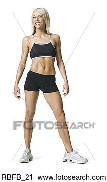 Stock Photography - full body shot 
of a young adult 
blonde woman in 
a black workout. 
fotosearch - search 
stock photos, 
pictures, images, 
and photo clipart