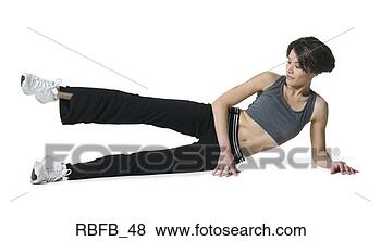 Stock Photo - full body shot 
of a young adult 
woman in a dark 
workout outfit 
as she. fotosearch 
- search stock 
photos, pictures, 
images, and photo 
clipart