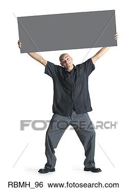 Stock Photo - a young hispanic 
male wearing grey 
slacks and a black 
shirt stands. 
fotosearch - search 
stock photos, 
pictures, images, 
and photo clipart