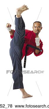 Stock Photo - an adult asian 
male amrtial arts 
expert practices 
karate by standing. 
fotosearch - search 
stock photos, 
pictures, images, 
and photo clipart