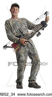 Stock Photo - an adult caucasian 
male hunter in 
camouflage plays 
his bow and arrows. 
fotosearch - search 
stock photos, 
pictures, images, 
and photo clipart