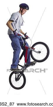 Picture - a caucasian teenage 
boy is wearing 
a bike helmet 
as her performs 
a. fotosearch 
- search stock 
photos, pictures, 
images, and photo 
clipart