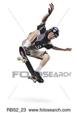 Stock Photo - a teenage caucasian 
male jumps up 
in the air on 
his skateboard 
while. fotosearch 
- search stock 
photos, pictures, 
images, and photo 
clipart