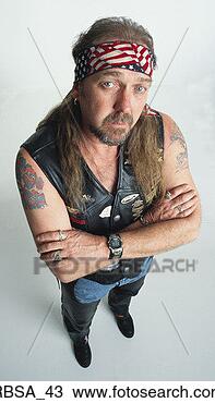 Stock Photo - middle aged caucasian 
adult male with 
an earring and 
 long hair and 
a. fotosearch 
- search stock 
photos, pictures, 
images, and photo 
clipart