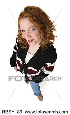 Stock Photograph - a redheaded caucasian 
female teenager 
in jeans and a 
black sweater. 
fotosearch - search 
stock photos, 
pictures, images, 
and photo clipart