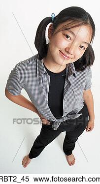 Stock Image - a cute young asian 
girl with ponytails 
wearing black 
stretch pants. 
fotosearch - search 
stock photos, 
pictures, images, 
and photo clipart