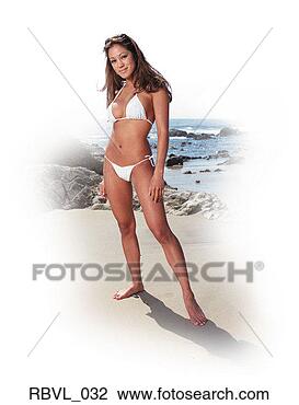 Stock Photo - a young long haired 
hispanic woman 
in a white bikini 
is standing on. 
fotosearch - search 
stock photos, 
pictures, images, 
and photo clipart