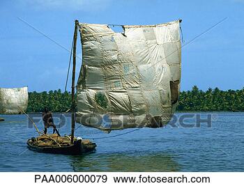 Stock Photograph - india, person 
on raft with patchwork 
sail. fotosearch 
- search stock 
photos, pictures, 
images, and photo 
clipart