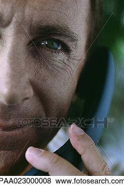 Stock Photo - man on telephone, 
cropped. fotosearch 
- search stock 
photos, pictures, 
images, and photo 
clipart