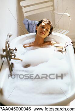 Stock Photo - woman taking bubble 
bath, front view, 
full length. fotosearch 
- search stock 
photos, pictures, 
images, and photo 
clipart