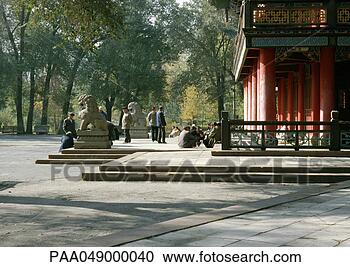 Stock Photography - china, xinjiang 
province, urumqi, 
people sitting 
in front of temple. 
fotosearch - search 
stock photos, 
pictures, images, 
and photo clipart