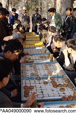 Stock Photography - china, xinjiang, 
urumqi, line of 
people playing 
mah-jong outdoors. 
fotosearch - search 
stock photos, 
pictures, images, 
and photo clipart