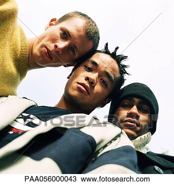 Stock Photo - three young men 
looking into camera, 
low angle view. 
fotosearch - search 
stock photos, 
pictures, images, 
and photo clipart