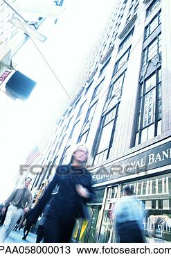 Stock Photo - people walking 
in street, low 
angle view, tilt, 
blurred. fotosearch 
- search stock 
photos, pictures, 
images, and photo 
clipart