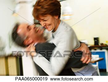 Stock Photograph - man holding woman 
in arms, blurred. 
fotosearch - search 
stock photos, 
pictures, images, 
and photo clipart