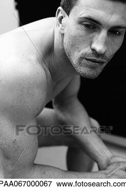 Picture - man sitting with 
elbows on knees, 
close-up, black 
and white. fotosearch 
- search stock 
photos, pictures, 
images, and photo 
clipart