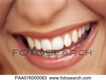 Stock Photo - woman's open mouth 
smiling and lower 
part of nose, 
close-up, blurred. 
fotosearch - search 
stock photos, 
pictures, images, 
and photo clipart