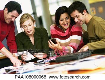 Stock Photo - business people 
working at table. 
fotosearch - search 
stock photos, 
pictures, images, 
and photo clipart