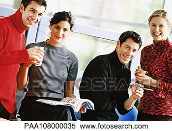 Stock Image - four people holding 
plastic cups, 
portrait. fotosearch 
- search stock 
photos, pictures, 
images, and photo 
clipart