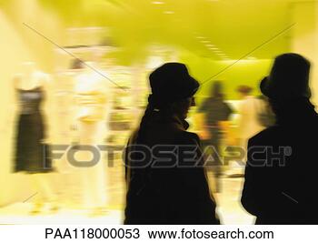 Stock Photo - silhouettes in 
front of clothing 
shop window, blurred. 
fotosearch - search 
stock photos, 
pictures, images, 
and photo clipart