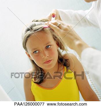 Picture - woman's hands 
fixing child's 
hair, close-up. 
fotosearch - search 
stock photos, 
pictures, images, 
and photo clipart