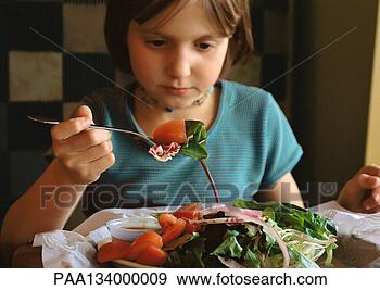Stock Photograph - young girl eating 
salad, portrait. 
fotosearch - search 
stock photos, 
pictures, images, 
and photo clipart