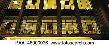Stock Photo - facade of office 
building at night, 
low angle view. 
fotosearch - search 
stock photos, 
pictures, images, 
and photo clipart