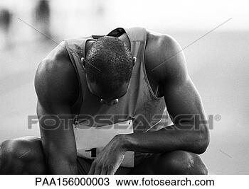 Stock Photo - male athlete crouching, 
head down, close-up, 
b&w. fotosearch 
- search stock 
photos, pictures, 
images, and photo 
clipart