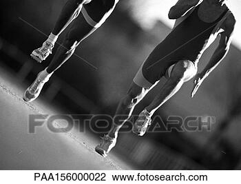 Stock Photo - male athletes 
running, close-up, 
b&w. fotosearch 
- search stock 
photos, pictures, 
images, and photo 
clipart