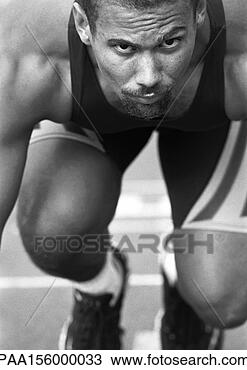 Stock Photo - male runner at 
start of race, 
close-up, b&w. 
fotosearch - search 
stock photos, 
pictures, images, 
and photo clipart