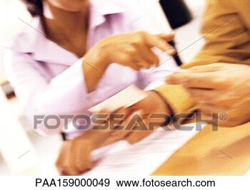 Stock Photograph - two people exchanging 
business cards, 
blurred, close-up. 
fotosearch - search 
stock photos, 
pictures, images, 
and photo clipart