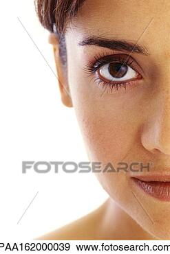 Stock Photograph - woman looking 
into camera, one 
side of face, 
close-up, portrait. 
fotosearch - search 
stock photos, 
pictures, images, 
and photo clipart