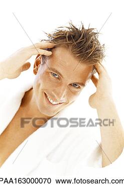 Stock Photography - man looking into 
camera, running 
fingers through 
hair, portrait. 
fotosearch - search 
stock photos, 
pictures, images, 
and photo clipart