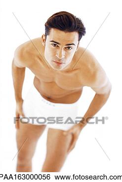 Stock Photo - man in underwear 
bending forward, 
looking into camera. 
fotosearch - search 
stock photos, 
pictures, images, 
and photo clipart