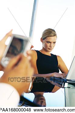 Stock Photo - businesswoman 
using computer, 
hands holding 
pocket computer. 
fotosearch - search 
stock photos, 
pictures, images, 
and photo clipart