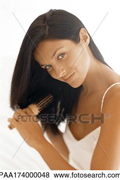 Stock Photo - woman brushing 
hair. fotosearch 
- search stock 
photos, pictures, 
images, and photo 
clipart
