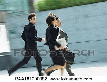 Stock Photo - business people 
running outdoors, 
blurred motion. 
fotosearch - search 
stock photos, 
pictures, images, 
and photo clipart