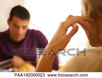 Stock Photo - woman sitting 
across from man 
at table, rear 
view. fotosearch 
- search stock 
photos, pictures, 
images, and photo 
clipart