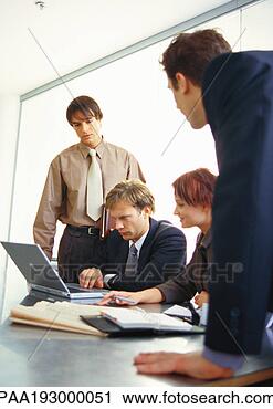 Stock Photography - business people 
working together 
at table. fotosearch 
- search stock 
photos, pictures, 
images, and photo 
clipart