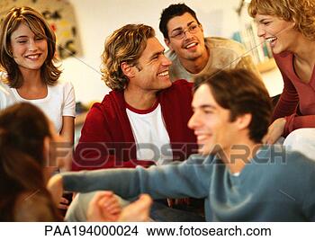 Stock Photo - group of young 
people sitting 
together, laughing, 
close-up. fotosearch 
- search stock 
photos, pictures, 
images, and photo 
clipart