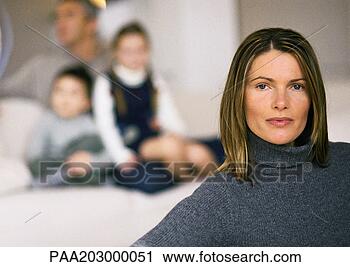 Stock Photography - woman in foreground, 
 head and shoulders, 
 man and two children. 
fotosearch - search 
stock photos, 
pictures, images, 
and photo clipart