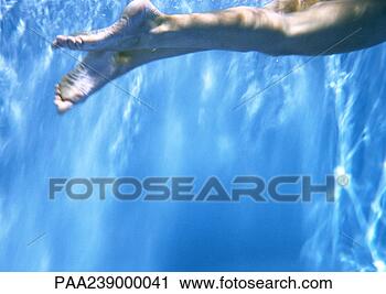 Stock Photography - person underwater, 
low section, close-up. 
fotosearch - search 
stock photos, 
pictures, images, 
and photo clipart